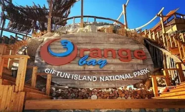 How far is Orange Bay from Hurghada by boat